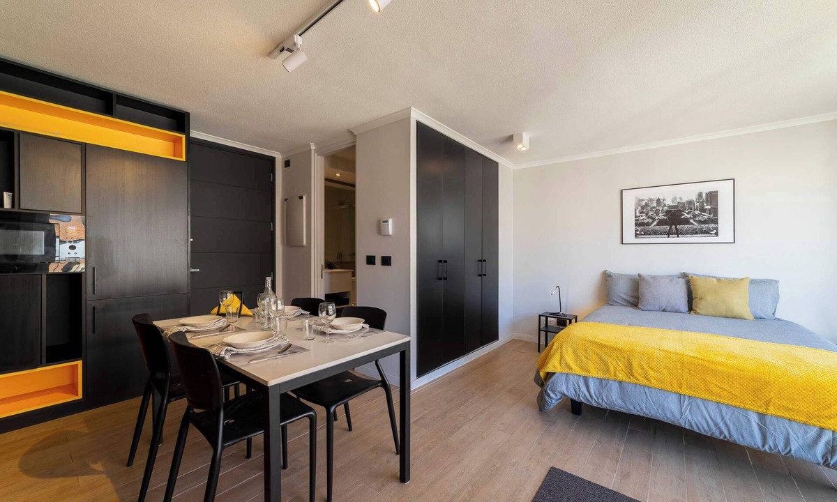 Santiago Apartment | Bright Studio: Pool, Gym, Balcony & City Views!