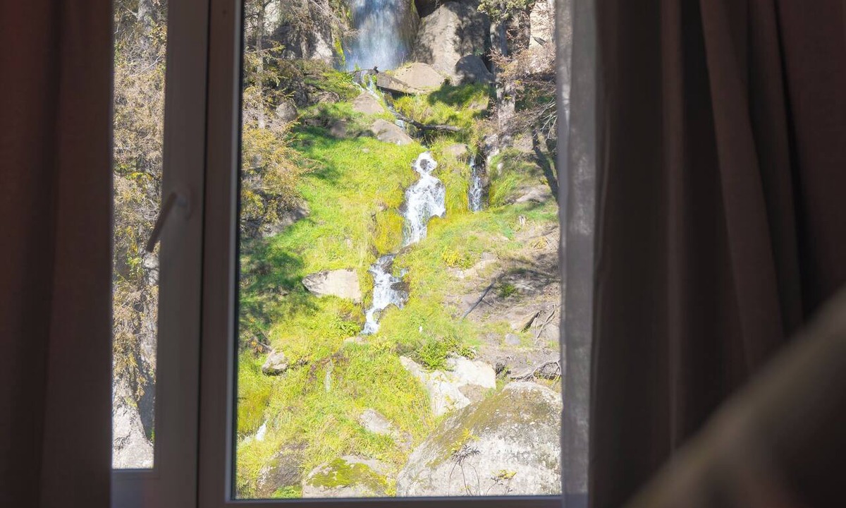 San Martin de los Andes Condo | Rest with the best view of the waterfall I Ayres del Bosque Accommodations