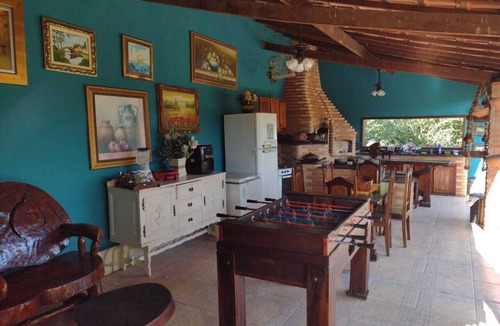 Quatis House | A charming place, with a suite featuring a fireplace.