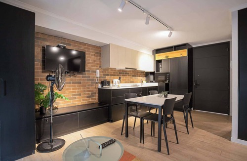 Santiago Apartment | Bright Studio: Pool, Gym, Balcony & City Views!