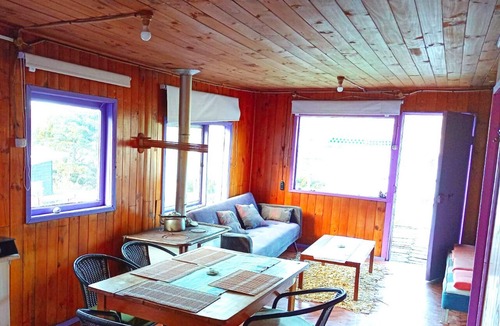 Bahia Mansa Cabin | Cabaña Maicolpue Rio Sur has a large terrace with beautiful ocean view.