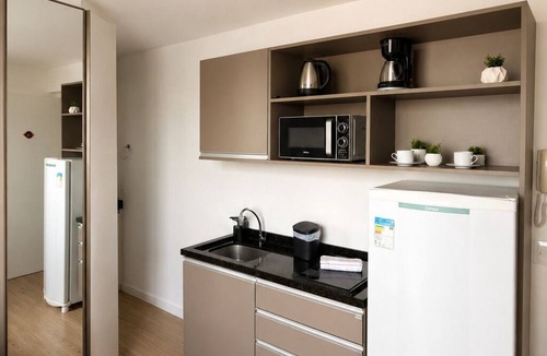 Prado Velho Apartment | Cozy, fully equipped studio apartment with coworking space, gym, and great location.
