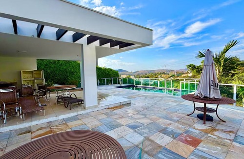 Capitolio House | Desert Hills Mansion with 8 Suites, View, Pool, and Style