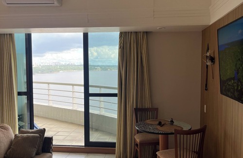 Ponta Negra Apartment | Flat River View - With a balcony and spectacular views of the Rio Negro.