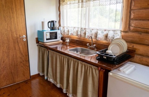 Villa Lia Apartment | Rustic cabin with a pool.