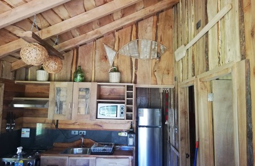 Pucon House | Wonderful rustic cabin 2, with native logs, on the banks of the Trancura River