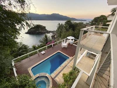 Casa cinematográfica de frente para o mar na Feiticeira in Ilhabela