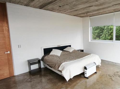 Concrete house overlooking the ocean and beach access