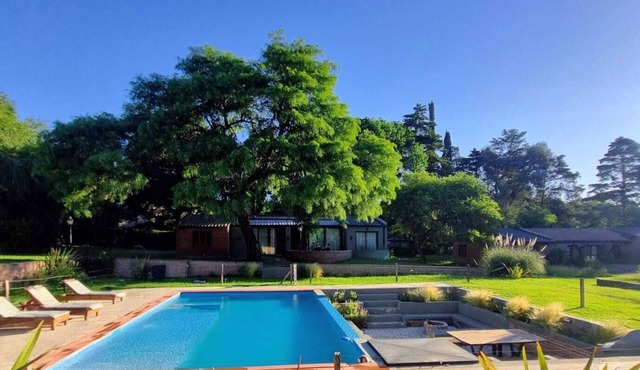 HOUSE LAS MAGNOLIAS IN VILLA GRAL BELGRANO FOR 8 PEOPLE WITH PARK AND SWIMMING POOL
