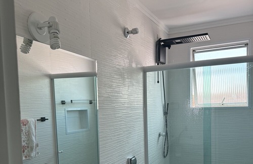 Embare Apartment | Walk to the beach and Shopping Mall. Private garage