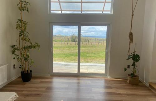 Punta Arenas House | Casa cálida vista al Estrecho y entorno natural