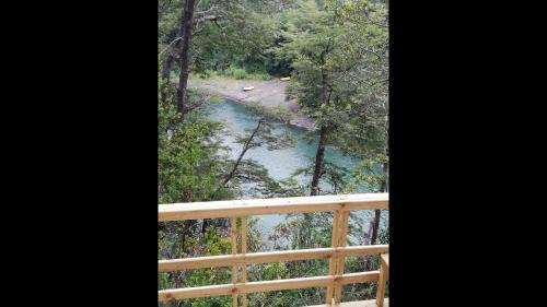 Pucon House | Wonderful rustic cabin 2, with native logs, on the banks of the Trancura River
