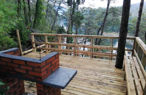 Pucon House | Wonderful rustic cabin 2, with native logs, on the banks of the Trancura River