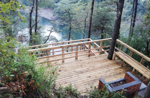 Pucon House | Wonderful rustic cabin 2, with native logs, on the banks of the Trancura River